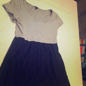Black knee length dress. Has pockets .
